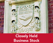 Engraved sigil on a building. Links to Closely Held Business Stock Engraved sigil on a building. Links to Closely Held Business Stock