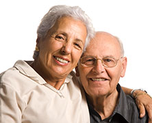 Photo of a man and woman smiling for a picture. Link to Life Stage Gift Planner Over Age 65 Gifts.