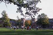 Photo of a group of people playing a game on a campus yard